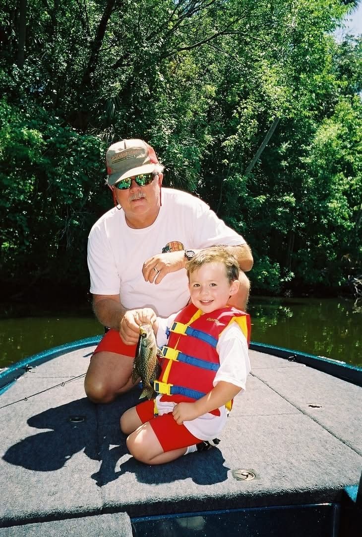 Captain Oliver and a young angler aboard the Bass Capital Expeditions boat